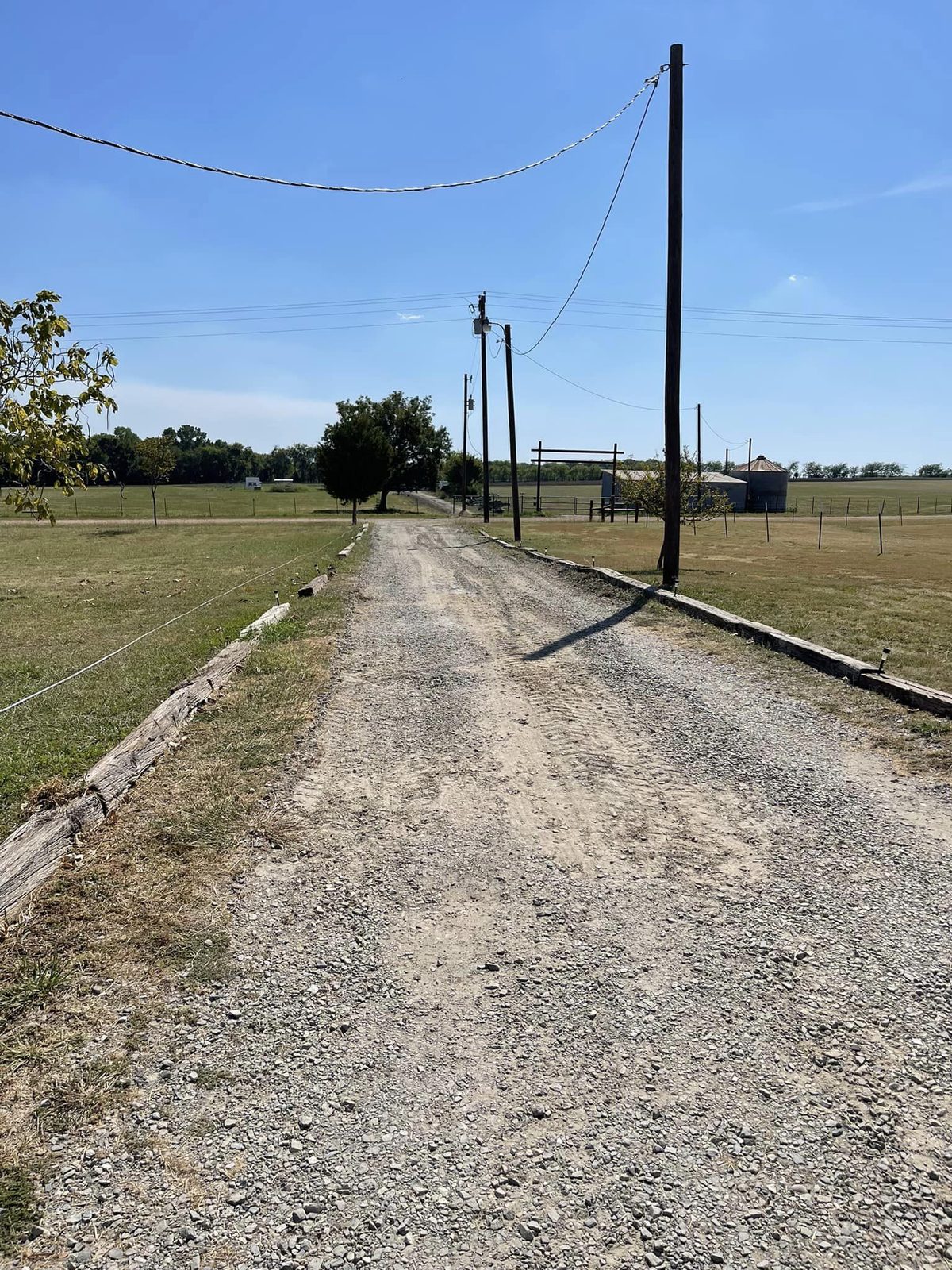Gravel driveway running through a property