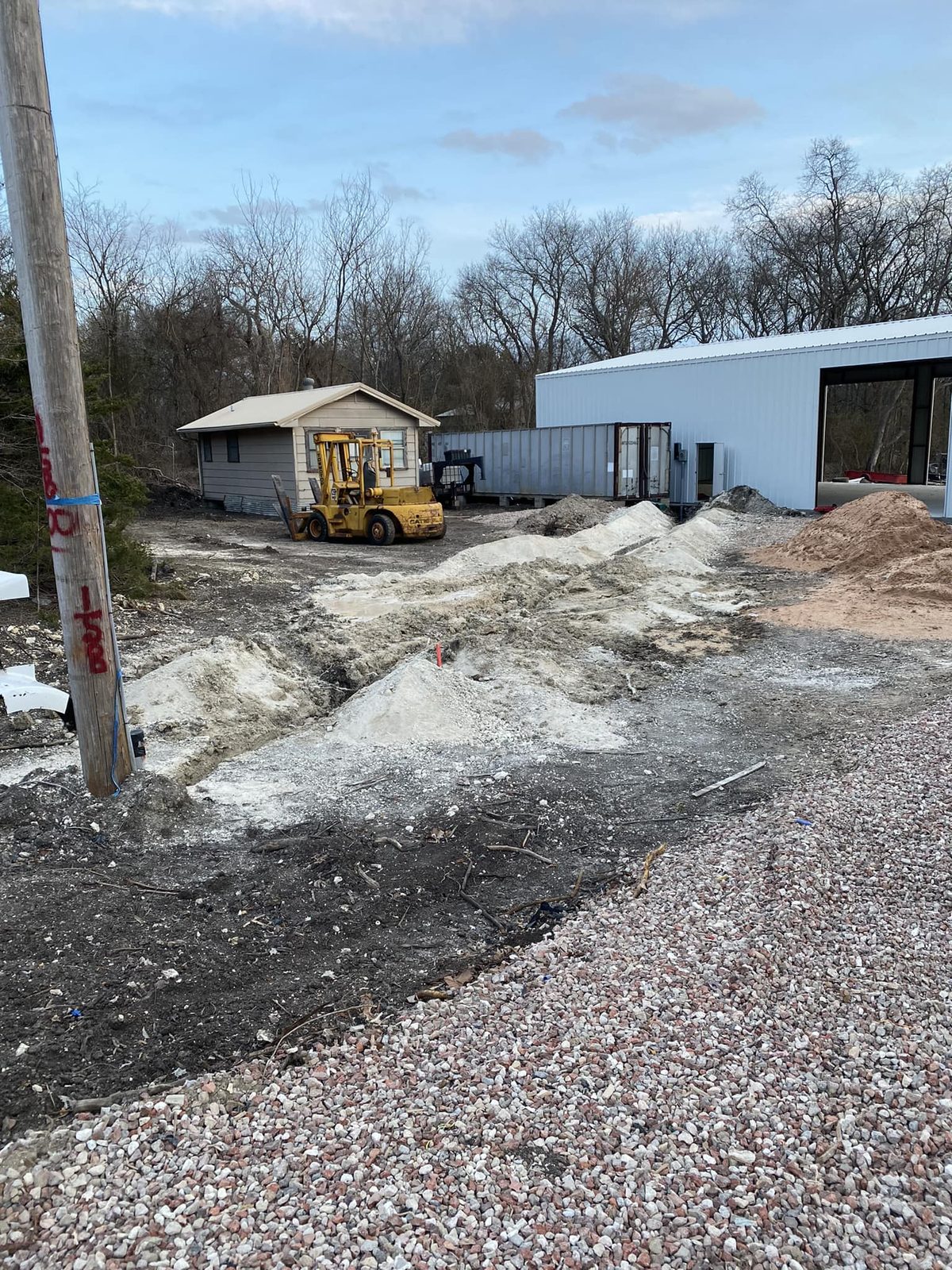 Fresh gravel pad beside a building