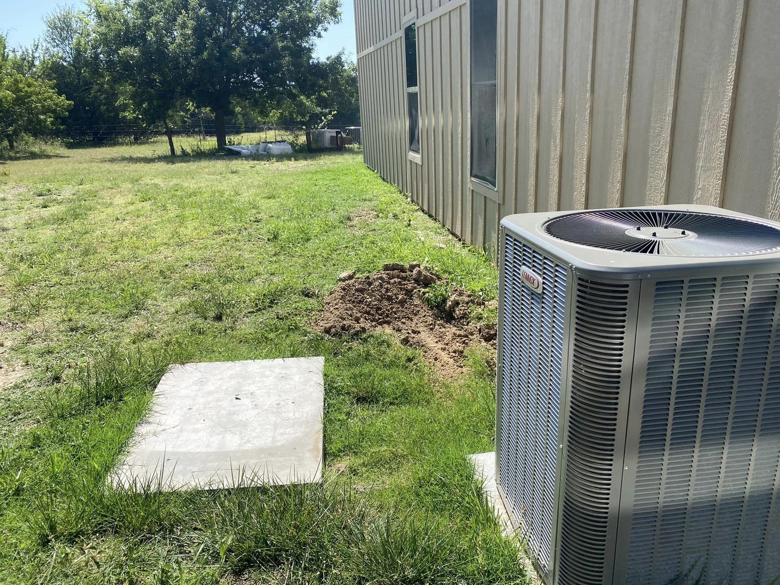 Utility pad and concrete work near a building